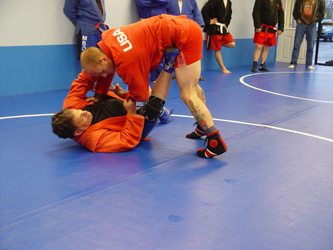 Coach Gregg Humphreys demonstrating a sacrifice throw.